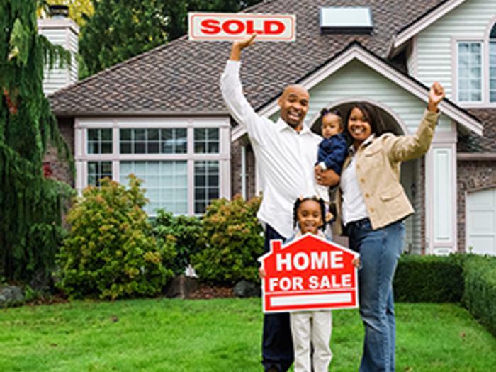 Sold sign in front of home