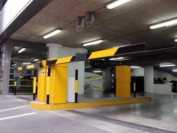 Public parking garage with reflective security gates