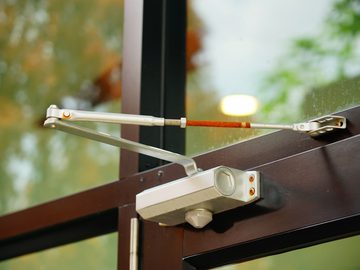 Rusted pedestrian door automatic closer