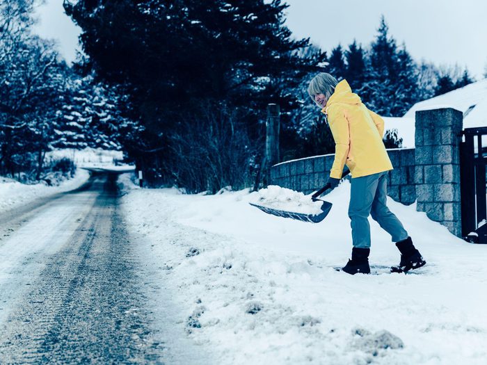 Senior Shoveling Snow Gate Min