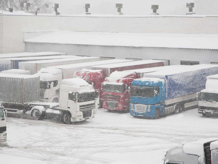 Trucks Busy Warehouse Winter Storm Min