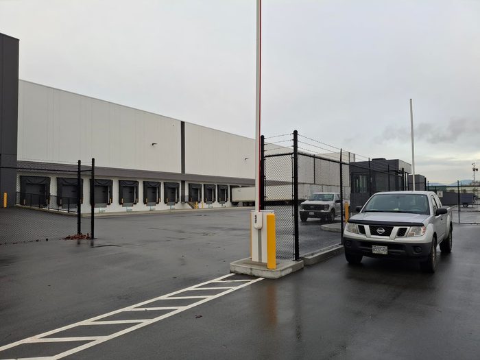 Warehouse with perimeter security gate