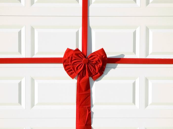 White Garage Door With Big Red Bow